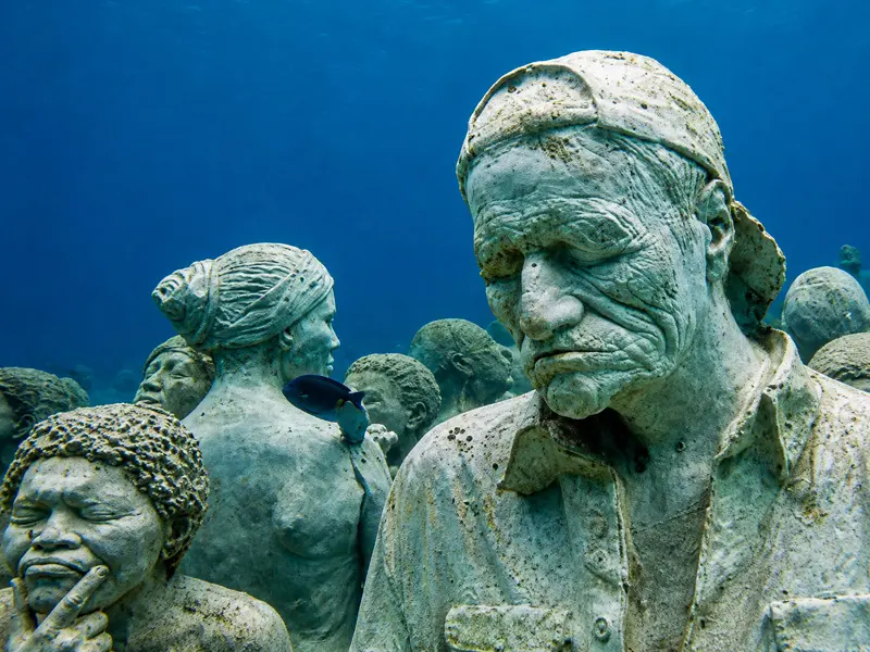 Scuba diving tours at MUSA Underwater Museum Cancun featuring life sized statue installations