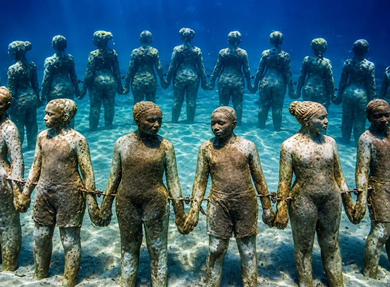 Scuba diving tours at MUSA Underwater Museum Cancun featuring life sized statue installations